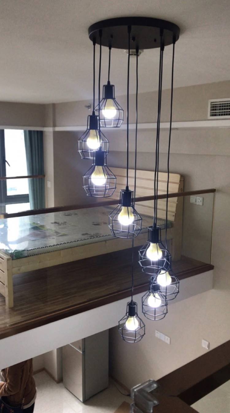 Modern pendant lights for rooms with double-height ceilings.