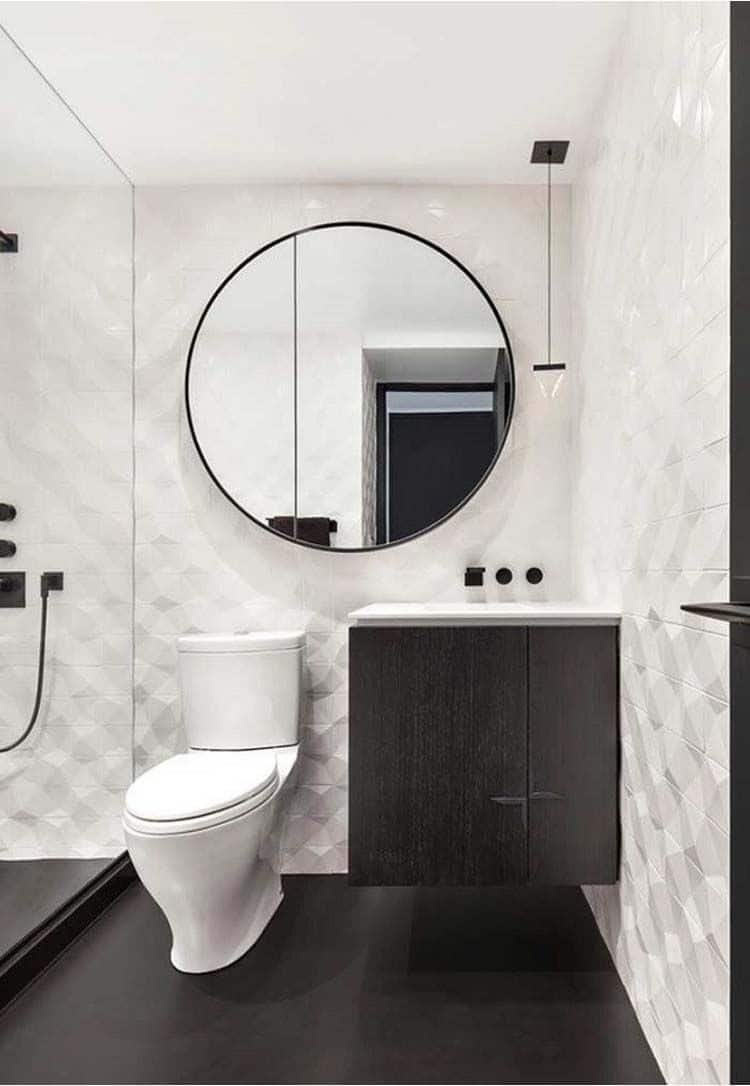 Black and white contrast beautifully in bathrooms, as seen here.