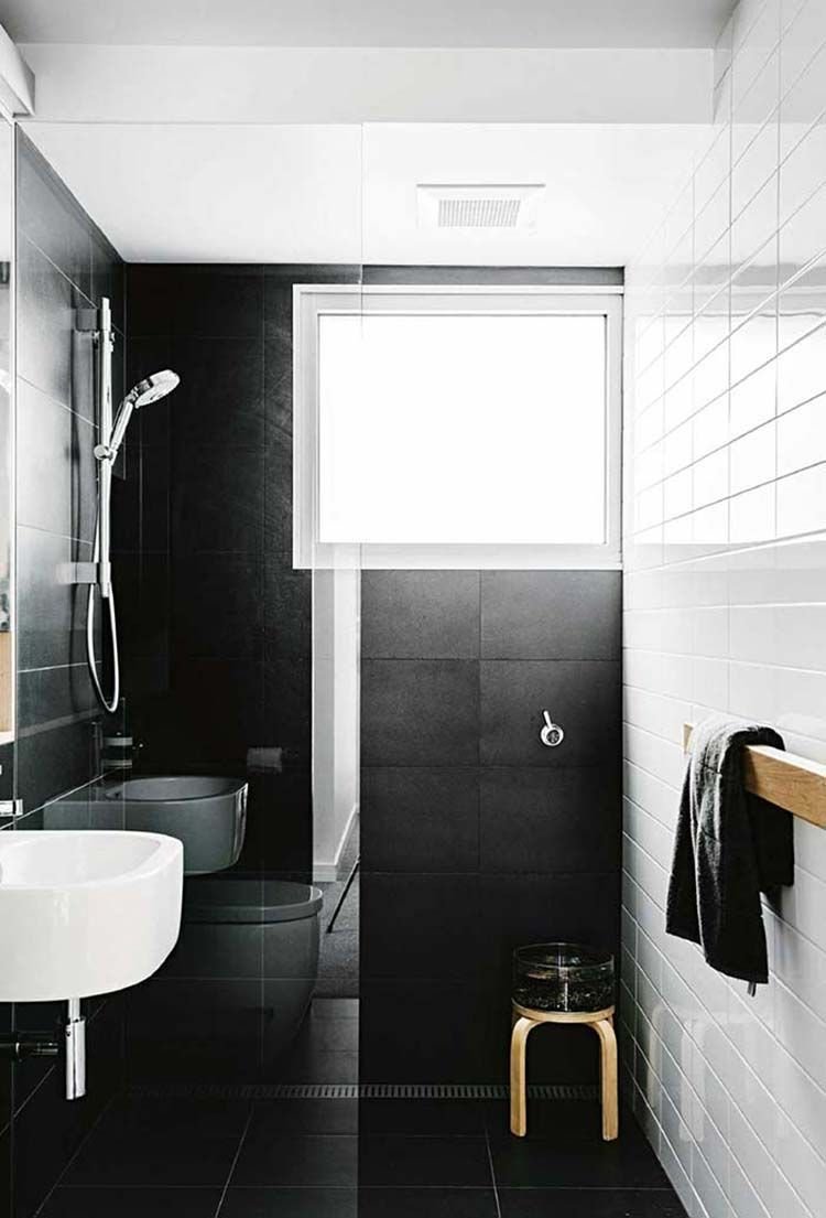 The black and white tiles in this shower area enhance the bathroom