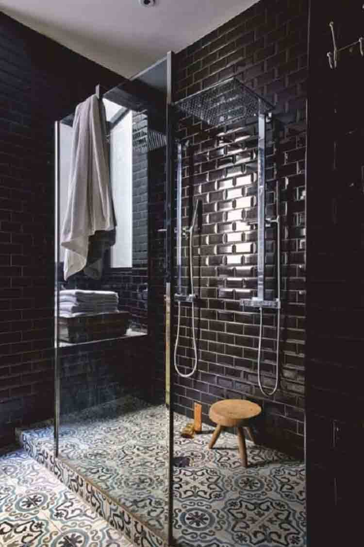 This bathroom design highlights black as the focal color, creating a near-monochromatic look.