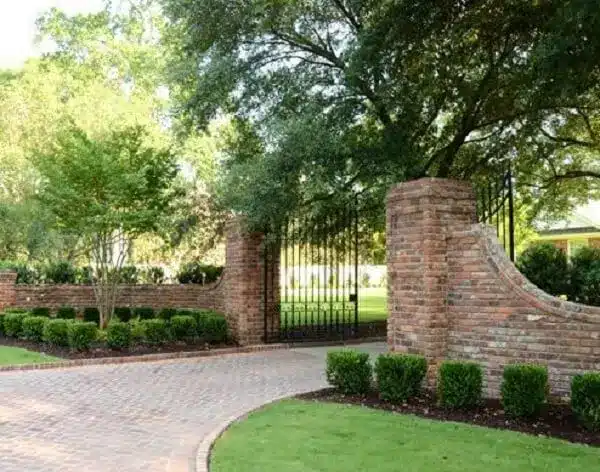 Side gardens enchant the entrance of the country house.