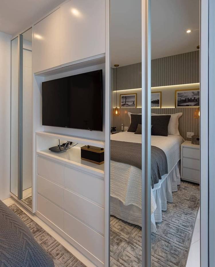 3. To save more space, a planned wardrobe with a specific area for TV is ideal for your room.