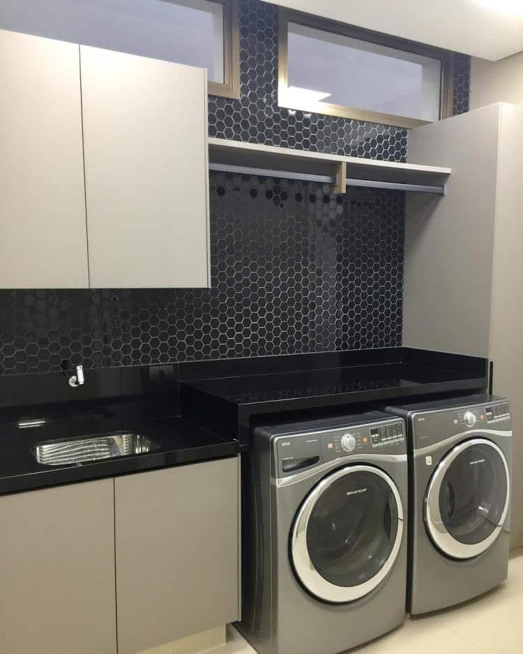 Inox appliances in an outdoor laundry area to prevent water damage.