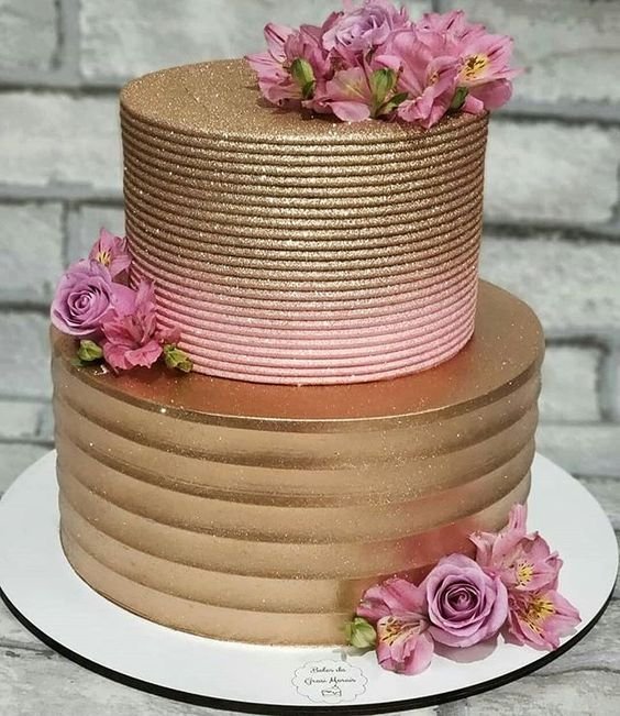 11. Fake flowers can also add glamour and elegance to a rose gold cake.
