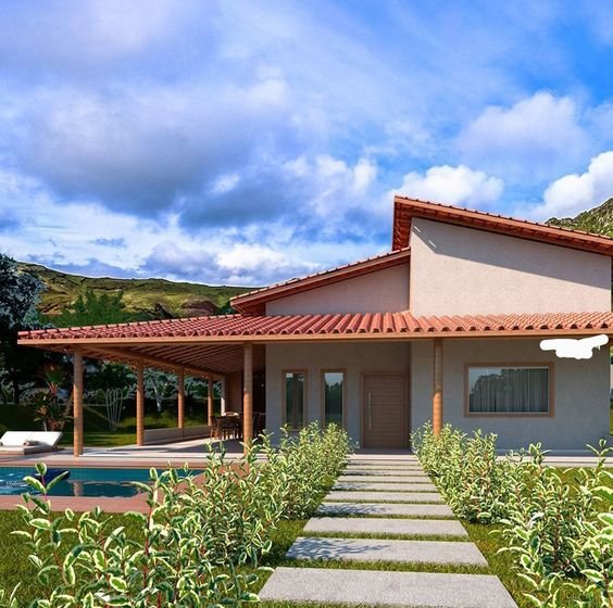 This image shows a house with a porch, characterized by a covered extension supported by pillars.