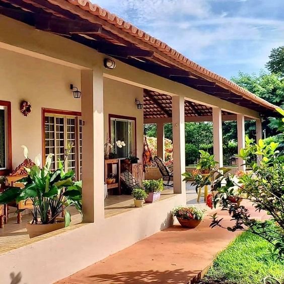 The image represents a cozy house with a porch, ideal for covered outdoor areas in spacious homes.