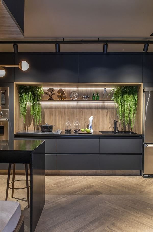 1. A black kitchen with black cabinets exuding elegance and modernity. The dark tones help in quick and practical cleaning.