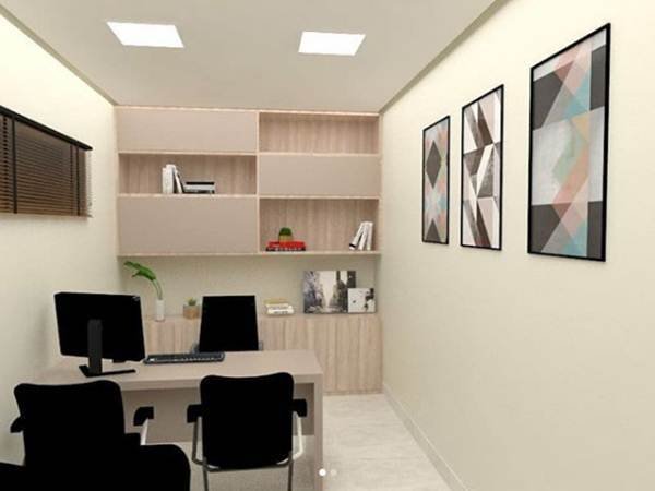 If the small office environment is more elongated, you can take inspiration from this design. The countertop, cabinet, and built-in shelves were made in a very delicate tone, in the background. The black chairs add more presence to the place, decorated with pictures in the same color palette.