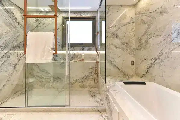 Calacatta marble cladding with a meticulous layout that aligns veins perfectly, adding a luxury touch to interiors.
