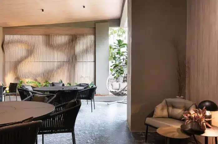 Polished black Portuguese stone cladding, featuring unique irregular patterns, suitable for various projects.