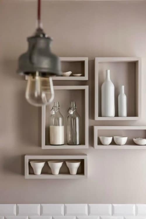12. Different shapes can be combined to compose the kitchen decor with niches. They serve not only to store kitchen utensils but also decorative objects.