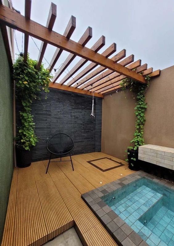 More traditional, wooden pergola covers the entire length of the balcony.