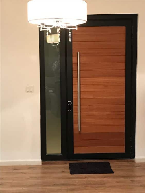 Iron and wood door exemplifying a rustic style.