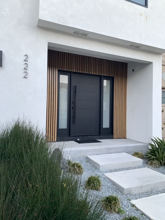 Iron doors with side panels, adding to the aesthetic appeal of homes.