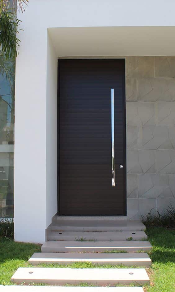 Cost-effective iron doors connecting home entry to the living room.
