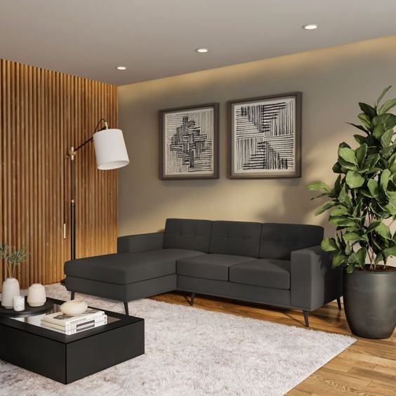 5. The longer sofa in a dark color, with wallpaper in a lighter color, helps to compact the long room.