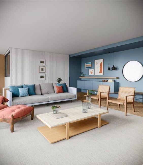 7. Dividing the space with a piece of furniture in the middle, such as a coffee table, can be a cool trick to disguise the length of the room.