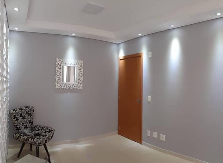 The closed molded cornice is a drop ceiling only where the wall meets the ceiling – not across the entire ceiling. It enhances the walls with directionable lighting.