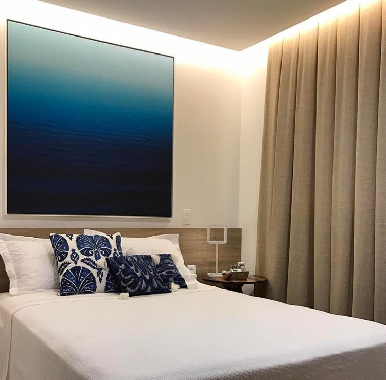 In this bedroom, we see an LED extending along the inverted molded cornice, solving the lighting challenge.