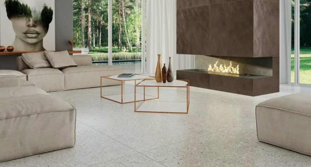 Living room with beige sofas and Ceusa porcelain on the floor – Photo: Ceusa