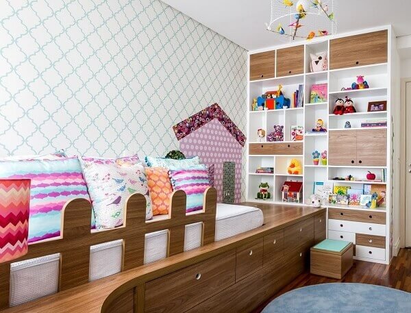 Colorful cushions and shelf with niches for children