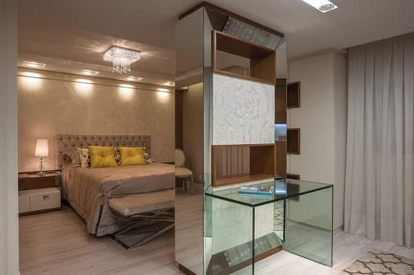 Upholstered headboard and shelf with mirrored niche.