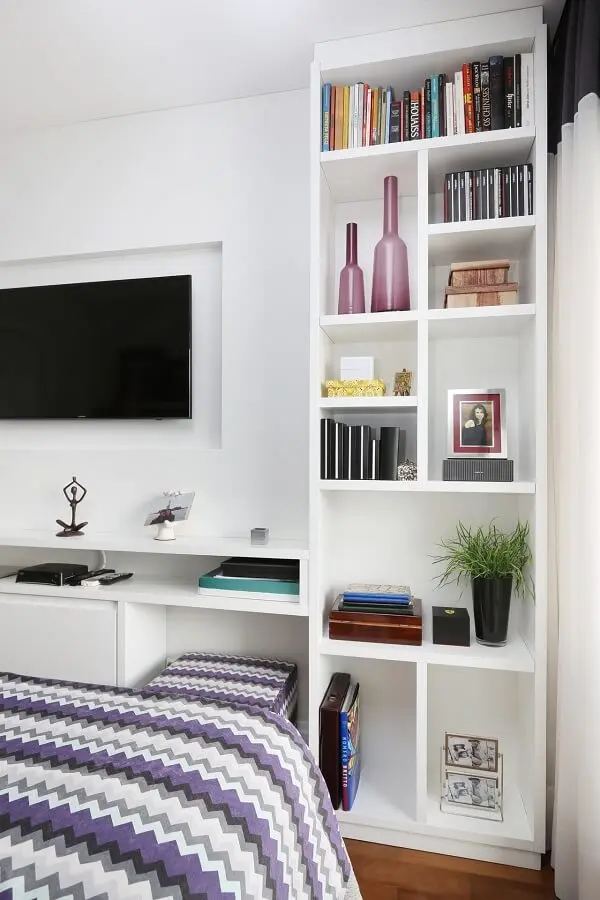 White shelf harmonizes with the space for television.