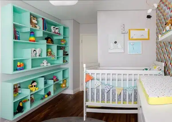 Green shelf with niches for baby room.