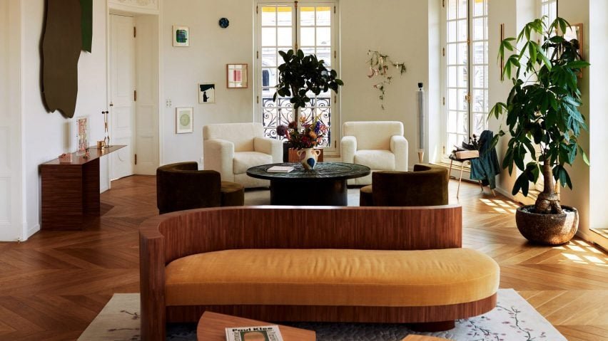 Cajsa Carlson | 30 June 2024 – Living room in Paris flat with curved sofas and gallery-like feel.