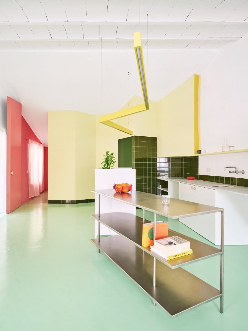Pastel primary colors in the renovation of a zigzagging partition home.